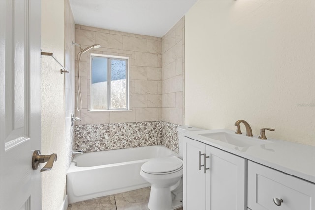 full bathroom with tiled shower / bath, vanity, toilet, and tile patterned flooring