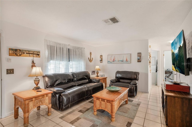 living room with light tile patterned flooring