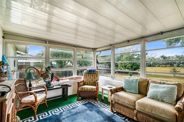 sunroom featuring wood ceiling