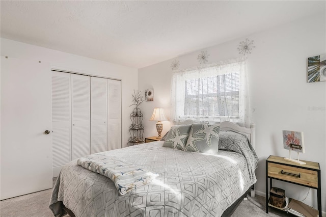 carpeted bedroom featuring a closet