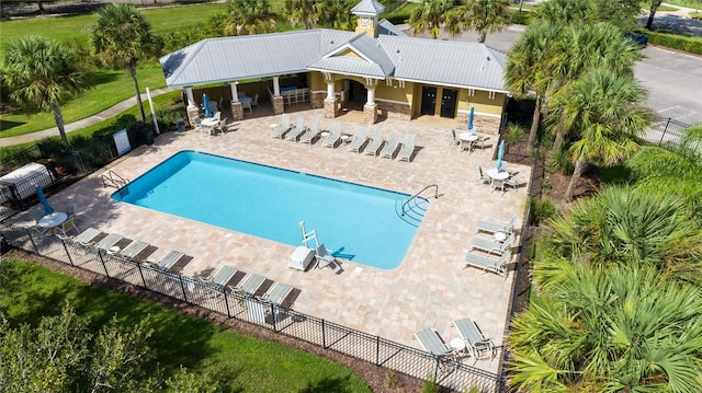 view of swimming pool with a patio area