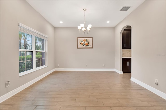 unfurnished room featuring baseboards, recessed lighting, visible vents, and light wood-style floors