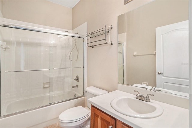 full bathroom with shower / bath combination with glass door, vanity, and toilet