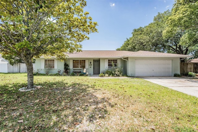 ranch-style home featuring a front yard and a garage