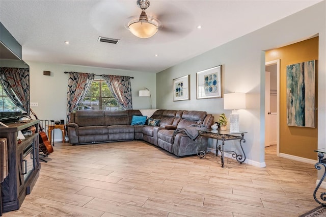 living room featuring ceiling fan