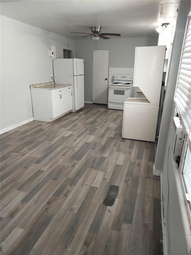 kitchen featuring white appliances, ceiling fan, dark hardwood / wood-style flooring, and white cabinets