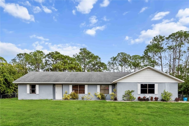 ranch-style home with a front lawn