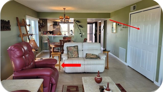 living room with a notable chandelier