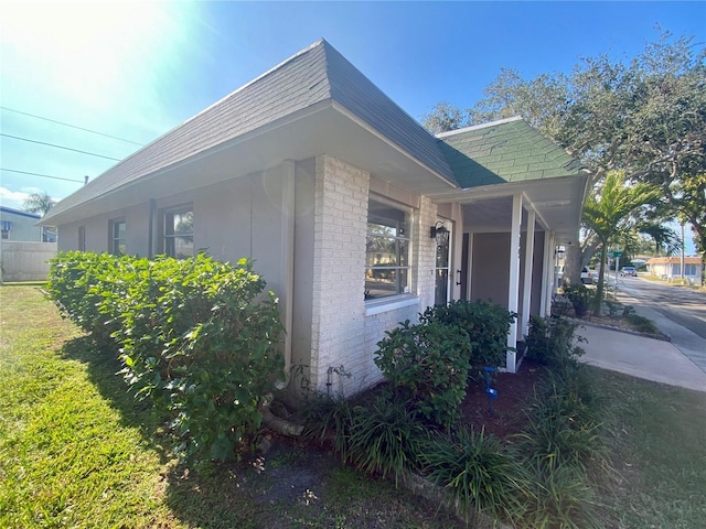 view of home's exterior featuring a lawn