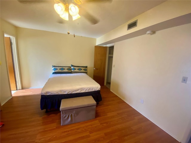 bedroom featuring ceiling fan and hardwood / wood-style flooring