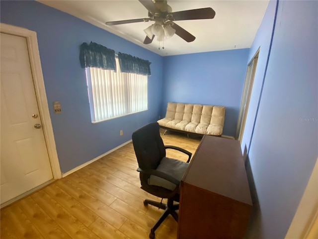 home office featuring ceiling fan and light hardwood / wood-style floors