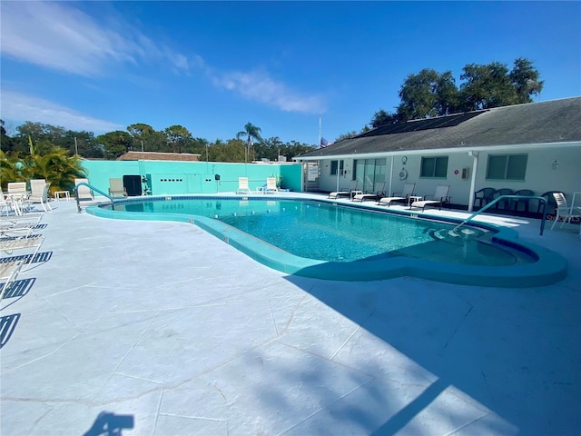 view of swimming pool with a patio