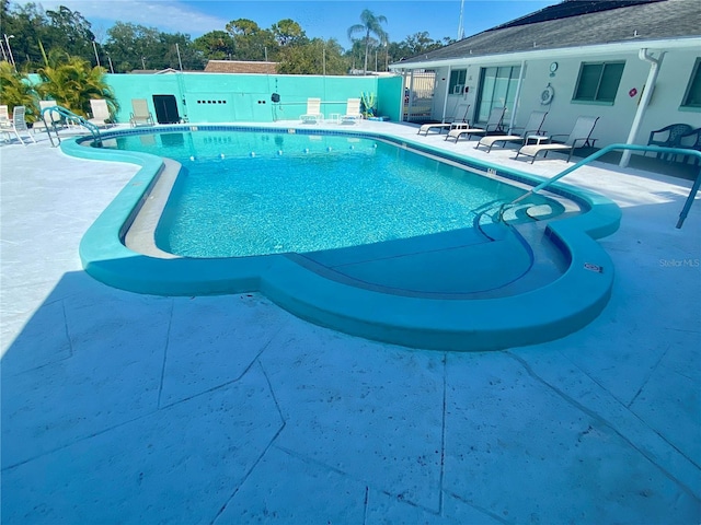 view of swimming pool with a patio