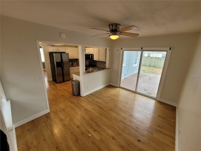 kitchen featuring white cabinets, light wood-type flooring, ceiling fan, stove, and stainless steel fridge with ice dispenser