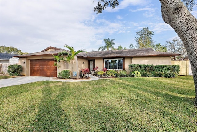 single story home with a front yard and a garage