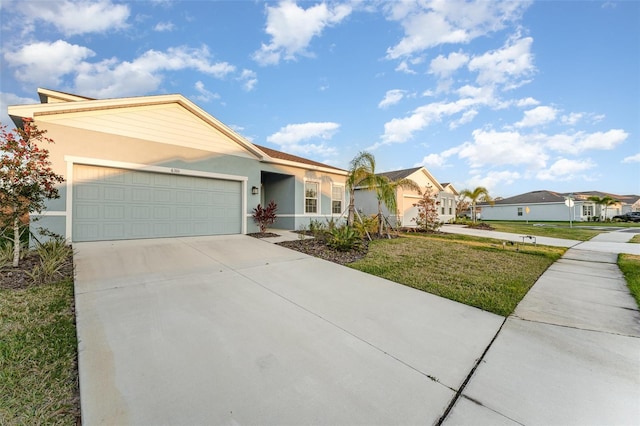 single story home featuring a front lawn and a garage