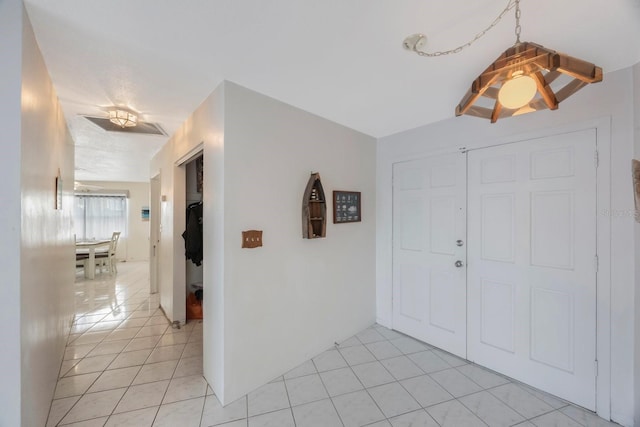 entrance foyer with light tile patterned floors