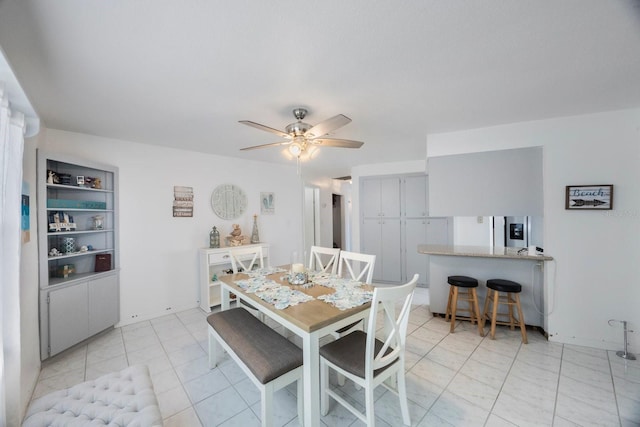 dining room featuring ceiling fan