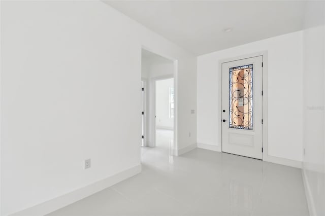 foyer entrance with light tile patterned flooring