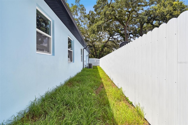 view of yard featuring central AC unit