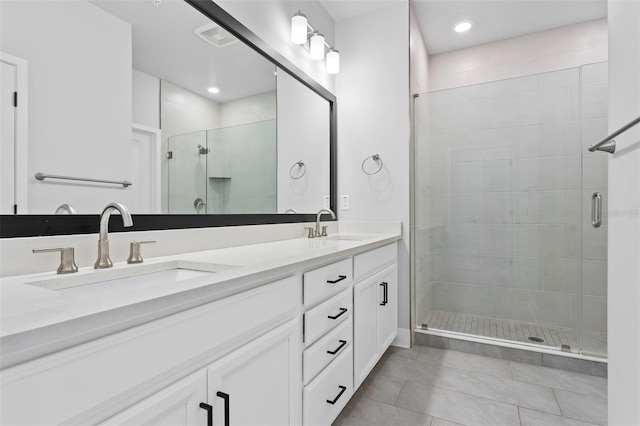 bathroom featuring vanity and an enclosed shower