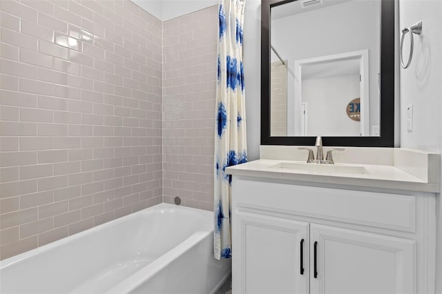 bathroom with vanity and shower / tub combo with curtain