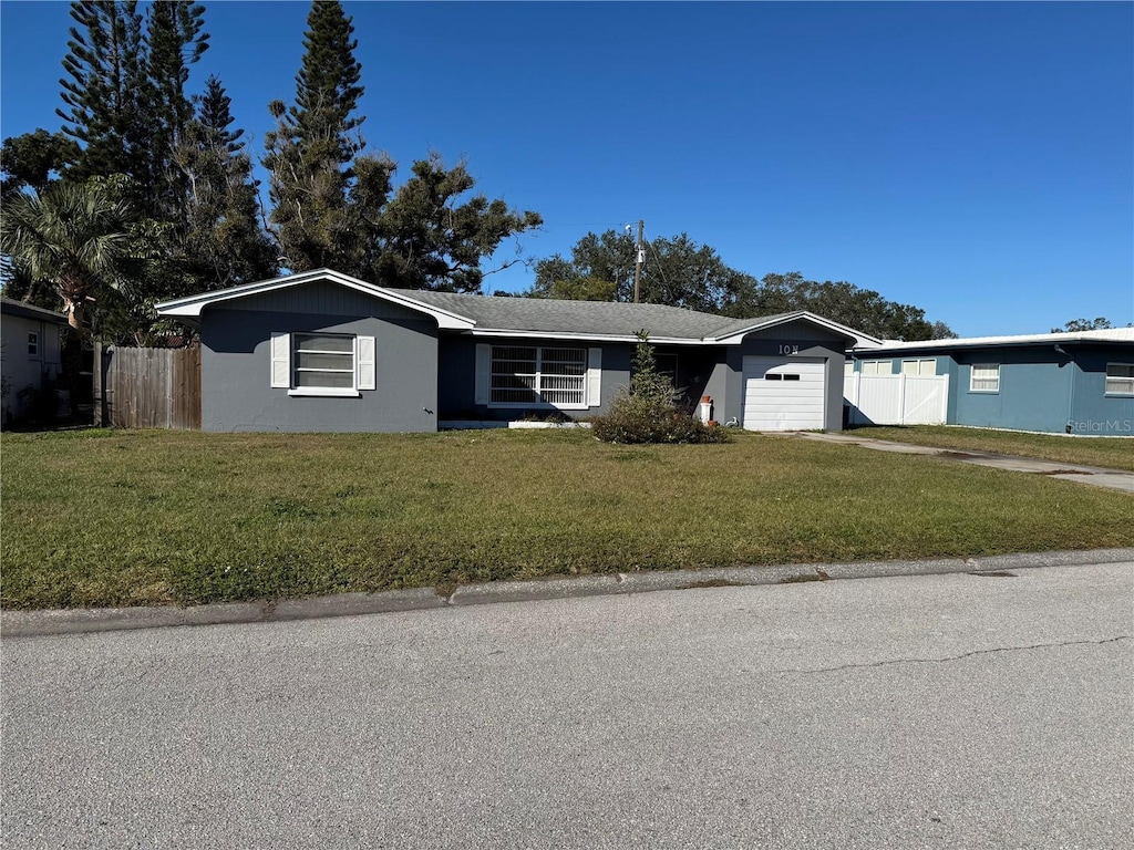 ranch-style house with a front lawn