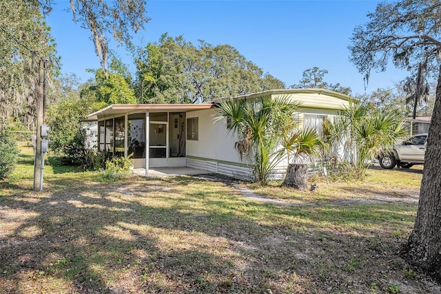 rear view of house with a sunroom