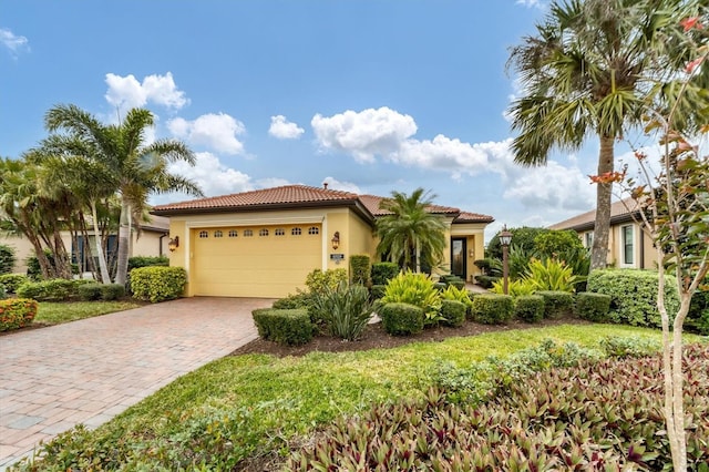 mediterranean / spanish-style home featuring a garage