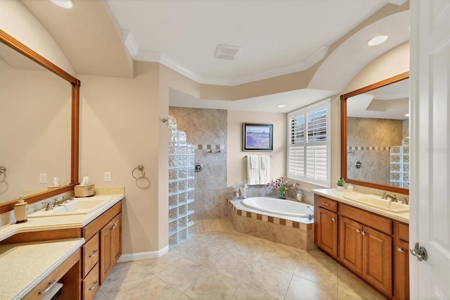 bathroom featuring crown molding, tile patterned flooring, vanity, and plus walk in shower