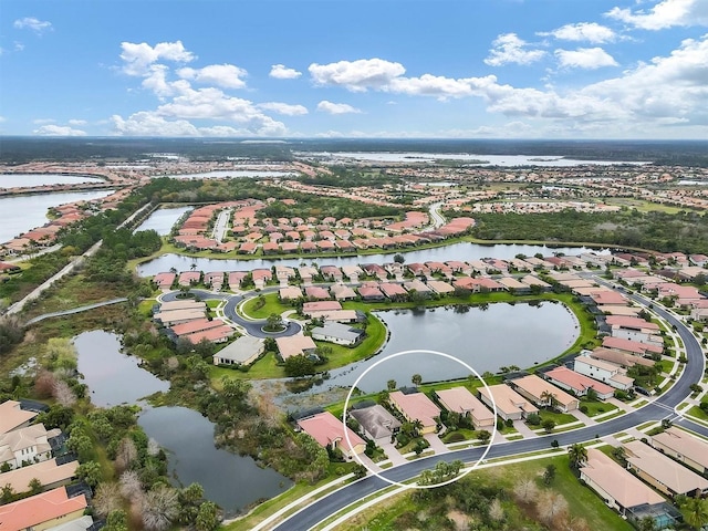 drone / aerial view with a water view