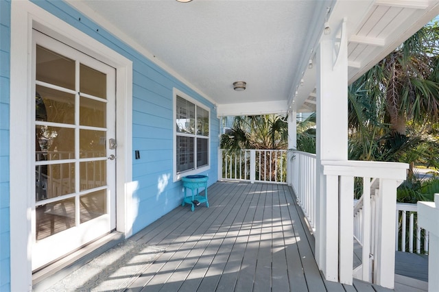 wooden deck featuring covered porch