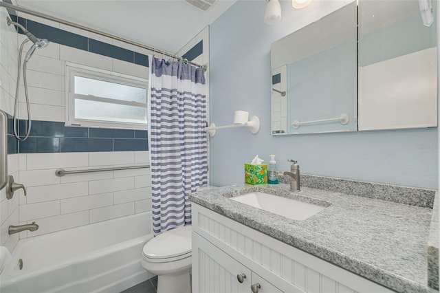 full bathroom featuring vanity, toilet, and shower / bath combo with shower curtain