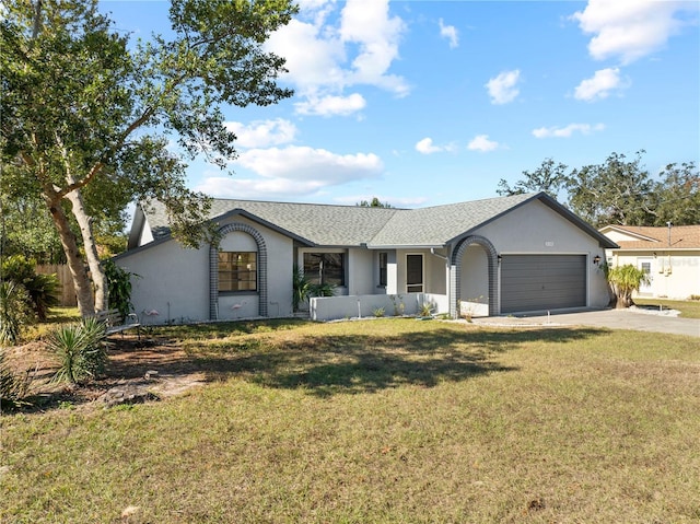 ranch-style home with a front yard and a garage