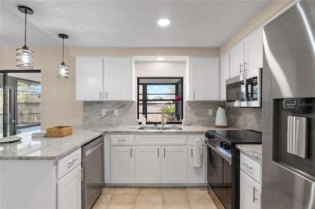 kitchen featuring stainless steel appliances and white cabinetry