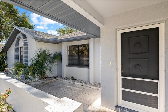 doorway to property featuring a patio