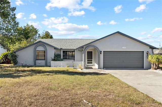 single story home featuring a garage and a front lawn