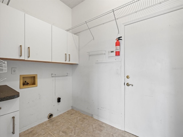 washroom featuring cabinets, hookup for a washing machine, and electric dryer hookup