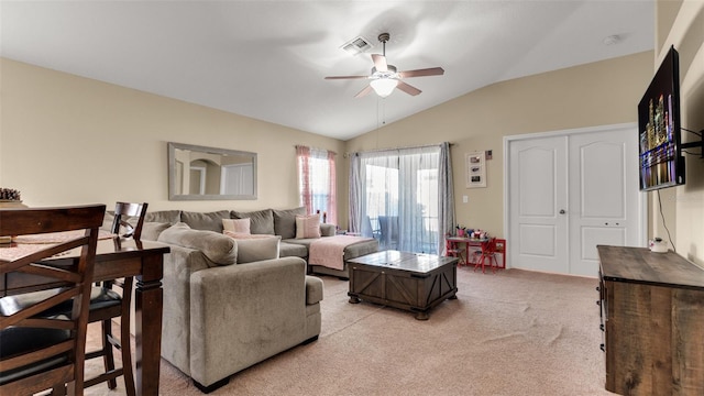 living room featuring ceiling fan, light colored carpet, and vaulted ceiling