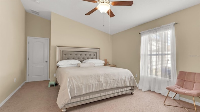 carpeted bedroom featuring ceiling fan and vaulted ceiling