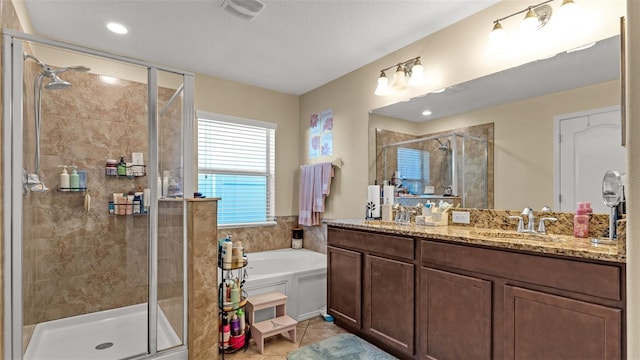 bathroom featuring tile patterned floors, vanity, and plus walk in shower