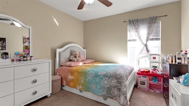 bedroom featuring light colored carpet and ceiling fan