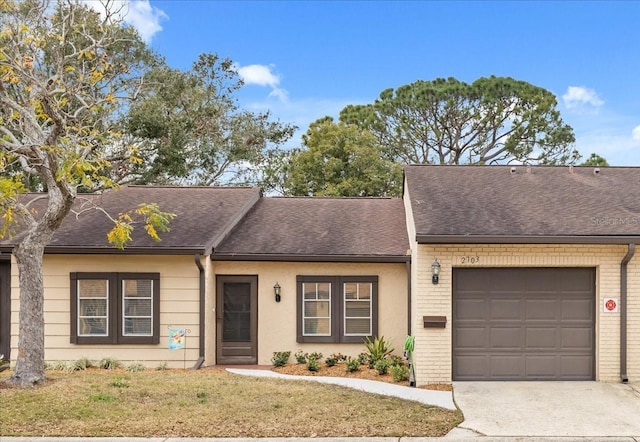 view of front of property with a front lawn and a garage