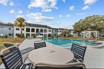 view of swimming pool with a gazebo and a patio