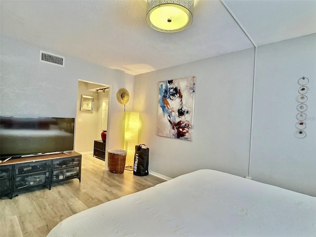 bedroom featuring hardwood / wood-style flooring