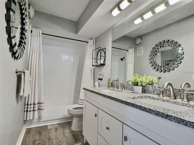 full bathroom featuring shower / bath combo, vanity, toilet, and wood-type flooring