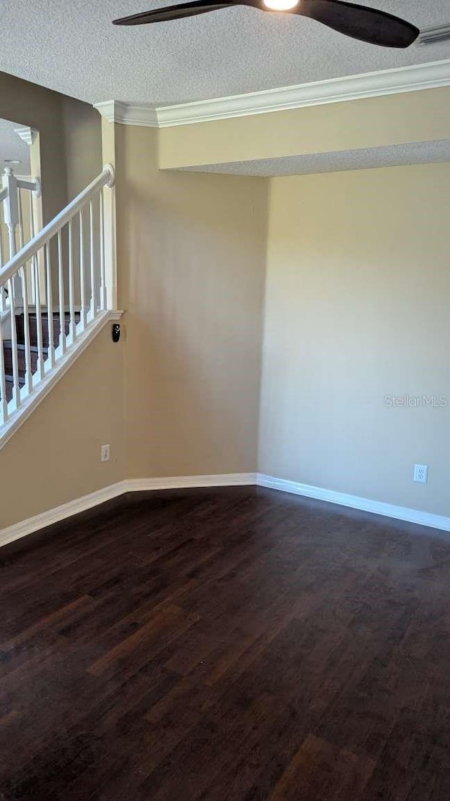 unfurnished room featuring ceiling fan, wood-type flooring, and a textured ceiling