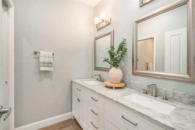 bathroom with wood-type flooring and vanity