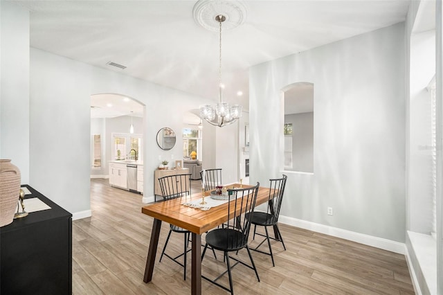 dining space with light wood-type flooring