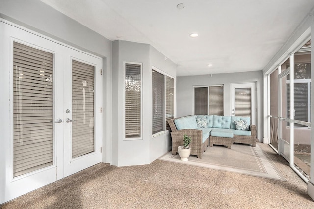 unfurnished sunroom with french doors